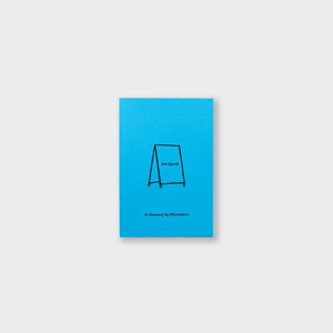 A small bright blue book on a grey background. The book is called Art Speak.