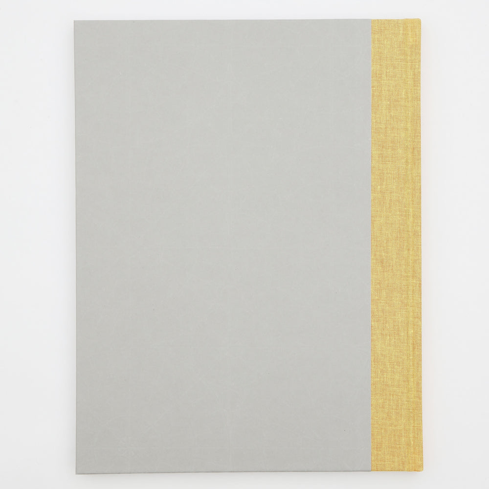 The back of a grey book with a yellow spine.