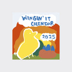 The cover of the Calendar with a yellow bird, blue eggs in a nest, ad the words 'Wigin' It Calendar 2025' in blue font.  