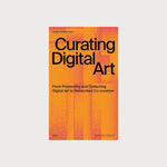 An orange book with black writing on a grey background. The book is titled Curating Digital Art.