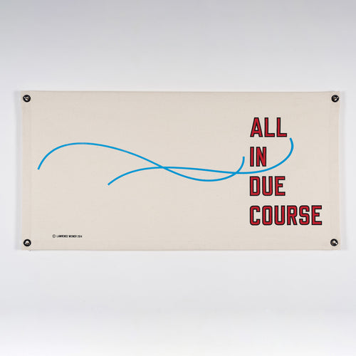 A cream fabric Lawrence Weiner limited edition artwork. It has blue lines and text that says All in Due Course.