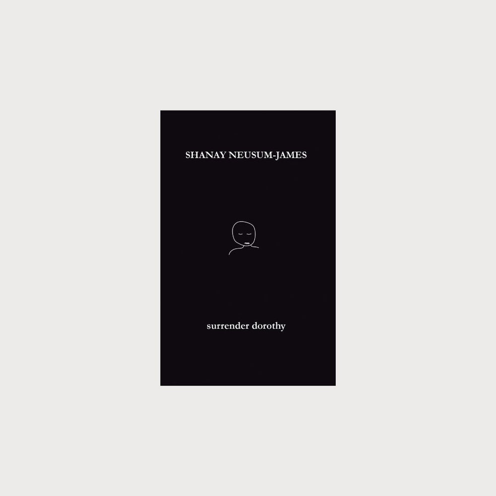 A black book on a white background. The cover of the book has an illustration of a person on it. The title of the book is surrender dorothy by Shanay Neusum-James. 