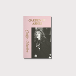 Pink book cover with gold lettering for the title in capital letters which reads Garden of Ashes, and in italics down the left hand side and vertically reads the author name Cookie Mueller. The front cover also has a black and white picture of a white woman in a long black top with jewellery around her neck shouting.