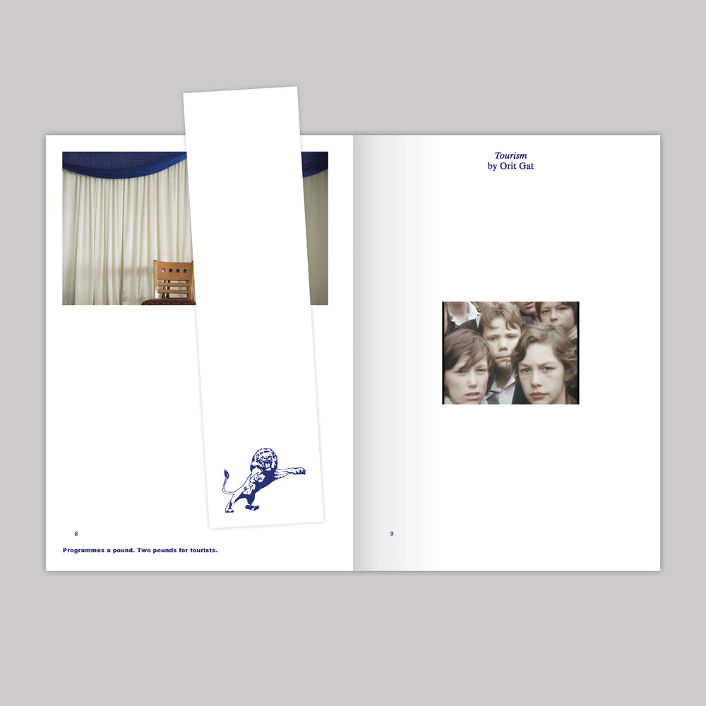 Image of the inner pages of the publication with a bookmark featuring the millwall lion mascot in blue ink. 