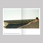 Inner pages of the publication featuring an image of a boy leaning against a wall inside the stadium. 