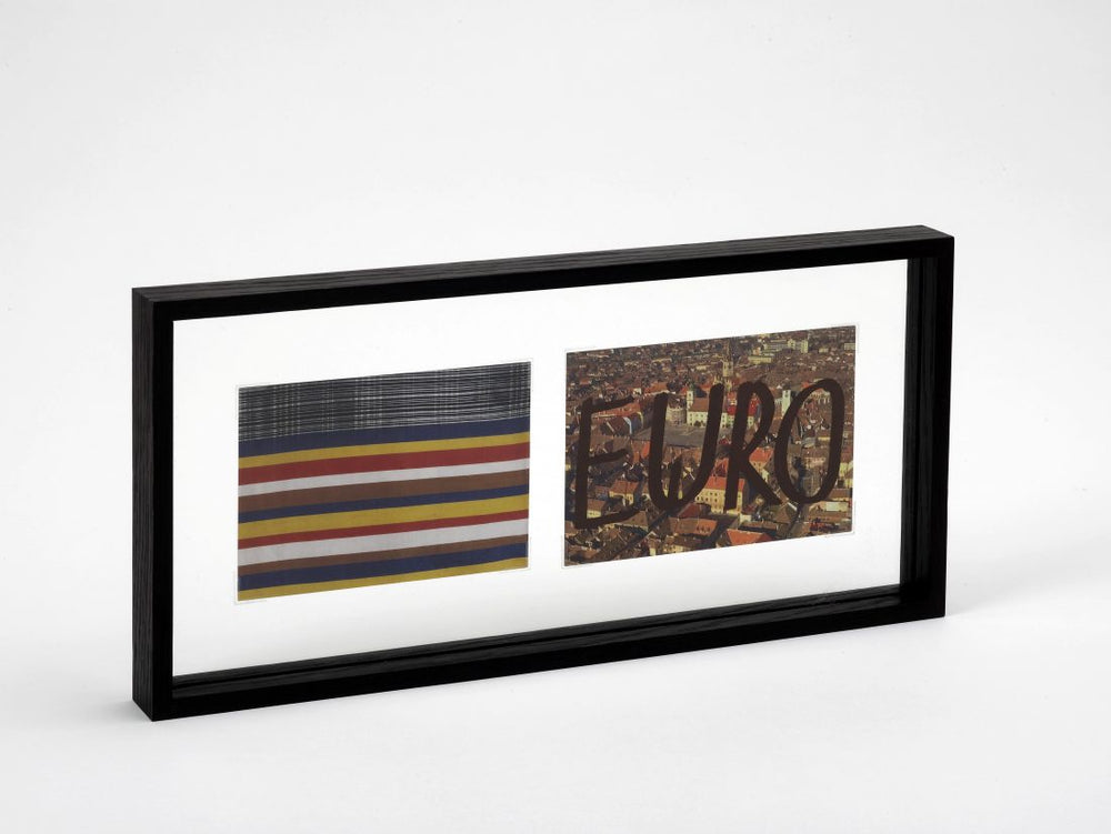 Two framed postcards in a black frame. One postcard is designed with colourful lines. The other is a photo of a city with the word EURO written on top of it. This is a limited edition artwork by artist Dan Perjovschi
