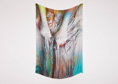 A limited edition artwork scarf by artist Katharina Grosse with a print of two hands clutching brightly coloured material.