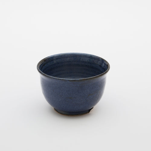 A small blue glazed ceramic bowl made by independent artist Alice King. Made in East Dulwich South London 