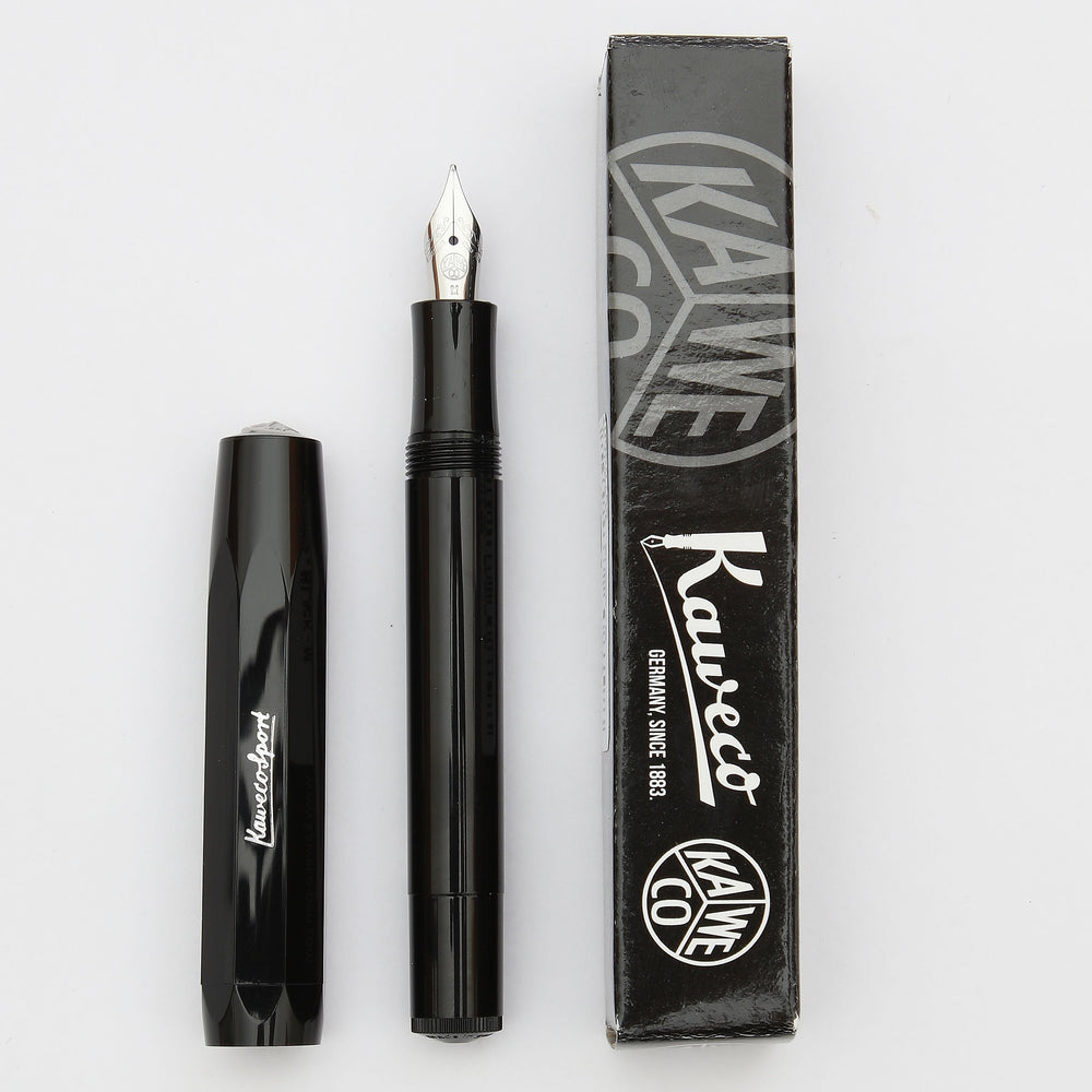 A shiny, sleek black fountain pen made by Kaweco