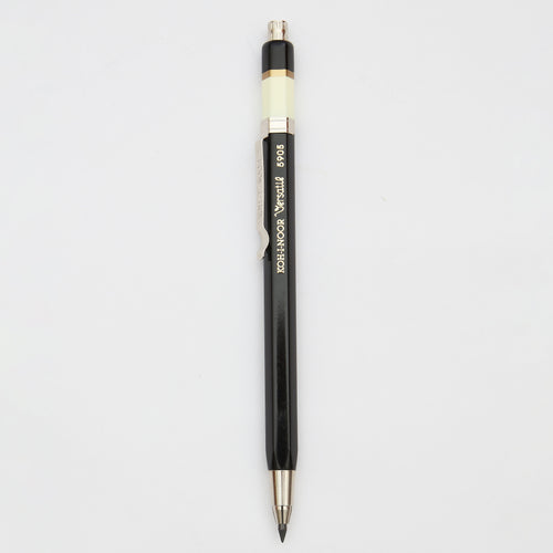A black, yellow and gold mechanical pencil 